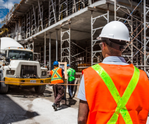 man supervising construction site