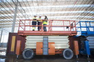 Low angle view of site managers and architect on viewing platform on construction site Low angle view of site managers and architect on viewing platform on construction site