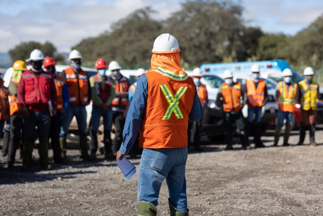 Team leader assigning a job for the team of technicians, foreman and engineers in a meeting
